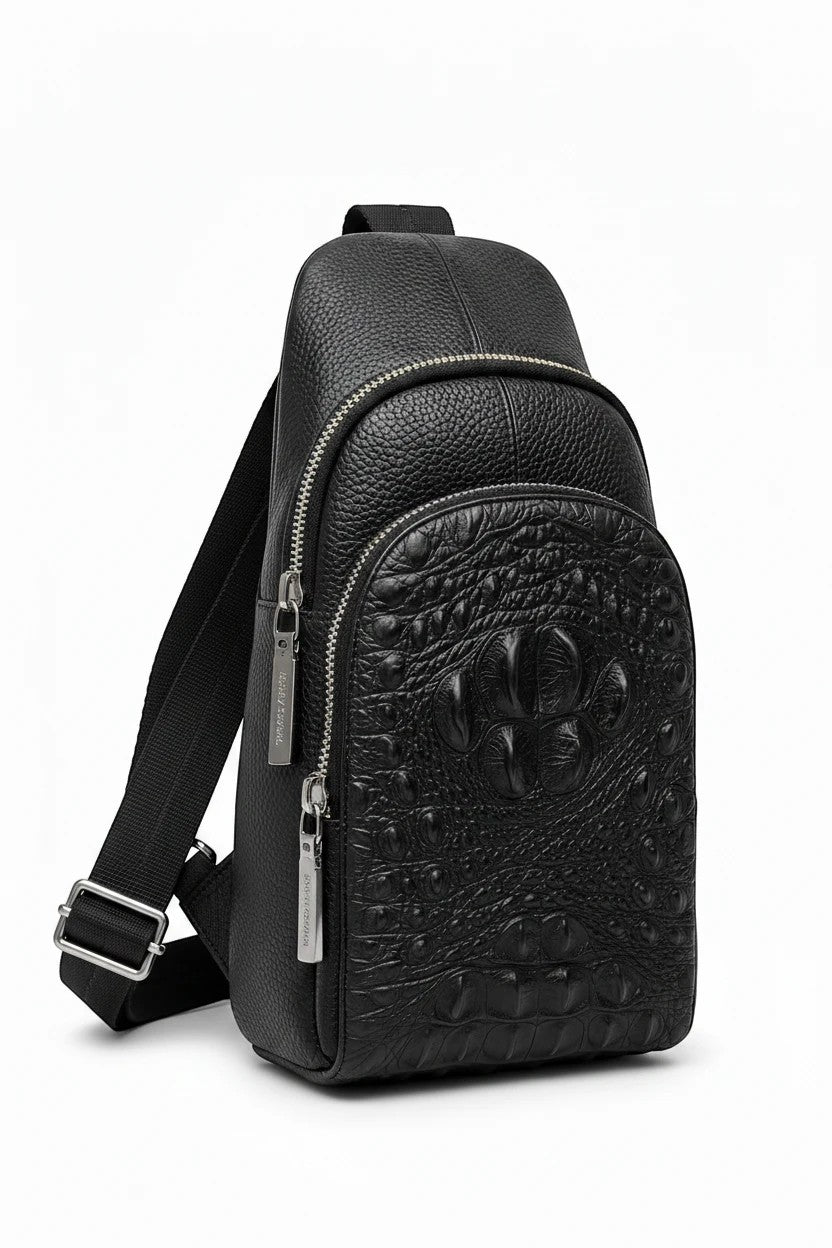 Barutti Bags & Accessories black leather sling bag with crocodile-embossed front panel and adjustable strap.