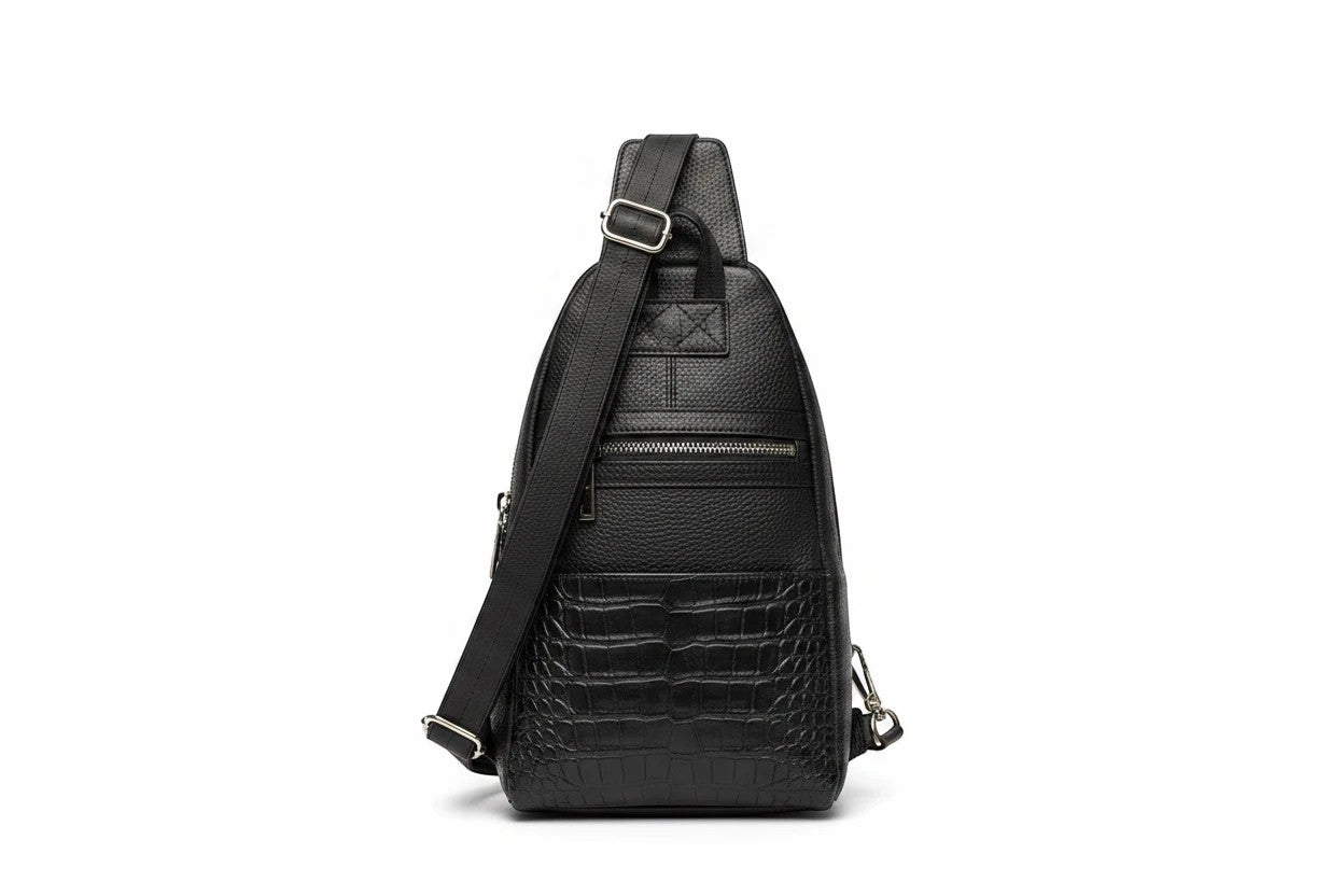 Barutti Bags & Accessories The Bergamo black leather sling bag with crocodile-embossed front and adjustable strap.