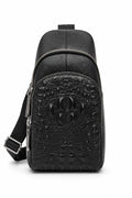 Barutti Bags & Accessories black leather sling bag with crocodile-embossed front panel and adjustable strap.