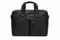 Barutti Bags & Accessories The Modena black full-grain leather laptop bag with brass zippers and front pockets.